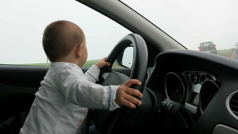 My daughter “driving” when she was still a baby